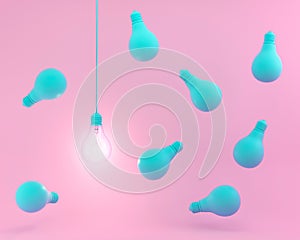 Hanging blue light bulbs with glowing one different idea on pastel pink background. Minimal concept. top view.