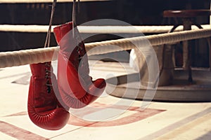 Hanging boxing gloves on a rope in horizontal