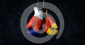 Hanging boxing gloves with the Russian and German flags illustrate the tensions between the two countries