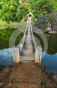 Hanging bridge across river to island