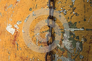 Hanging chain on an old battered boat