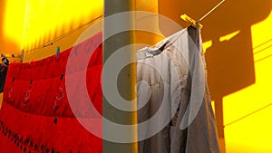 Hanging Clothes on Yellow Wall