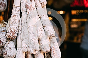 Hanging Cured Sausage Salame Corallina In Local Market. Italian Cuisine photo