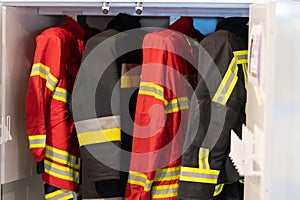 Hanging firefighter jackets and helmets.