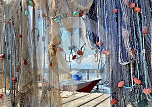 Hanging fishing nets stowed on a pontoon