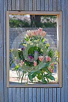 Hanging flower basket in window