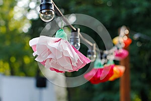 Hanging garland of light bulbs and flowers