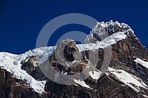 A hanging Glacier, clinging to a peak at the top of one of the mountains in the Torres Del Paine National Park Patagonia