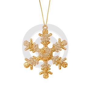 Hanging golden snowflake Christmas tree ornament isolated on a white background. Stock photo