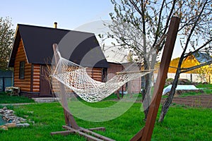 Hanging hammock on the beach. For a girl 's rest in nature .There is a small fishing