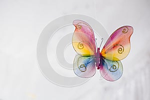 Hanging handmade butterfly in rainbow colors for venue decor or ornament