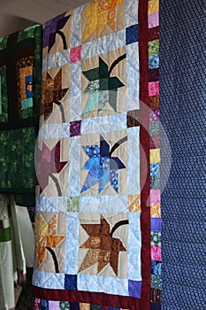 Hanging hangin Amish handmade quilts