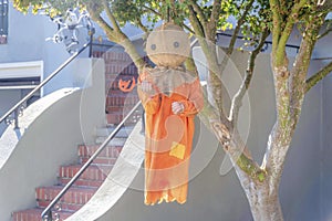 Hanging holloween ornament doll with orange clothes in San Francisco, California