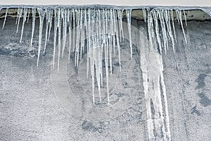 Hanging Icicles on The Building Wall During Frosty Winter Season