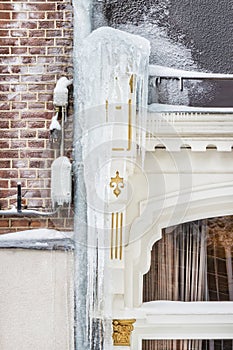 Hanging icicles on a historic house in the Dutch city center of Doesburg during a cold winter