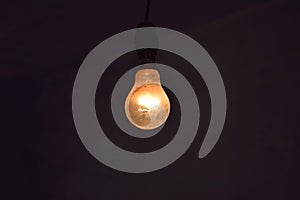 Hanging incandescent light bulb