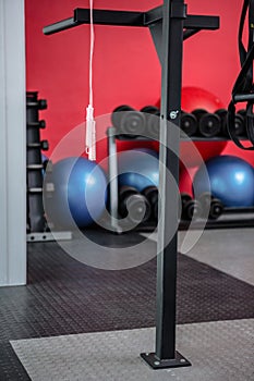 Hanging jump rope with exercise balls and weights behind them