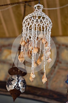 Hanging lantern made of seashells