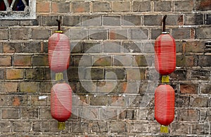 Hanging the lanterns on the wall at Fenghuang Ancient Town in Hunan, China