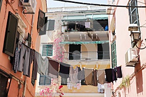 Hanging laundry on a narrow street in Corfu Greece
