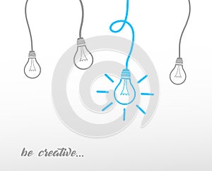 Hanging light bulbs reminding of an idea with slogan. photo
