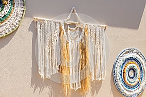 Hanging Macrame Tapestry Macrame Wall Pendant, boho handcrafted decorations.Stylish boho macrame wall hanging on beige