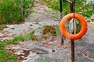 Hanging Orange Live-saver Ring on a Post