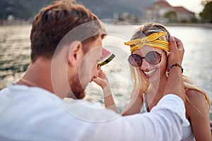 Hanging out at the lake.Romantic holiday.  loving man and woman sitting together on lake bank and enjoying