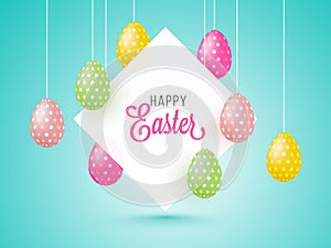 Hanging Painted Eggs and Happy Easter Message Card or Frame on Light Blue