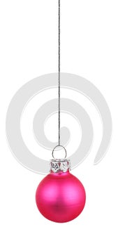 Hanging pink Christmas ornament isolated on white