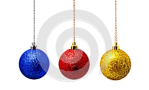 Hanging red blue and yellow christmas ball isolated on a white