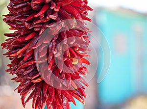 Hanging Red Chili Peppers drying at farmers market in southwest New Mexico USA