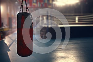 Hanging red sanbag in front of boxing ring