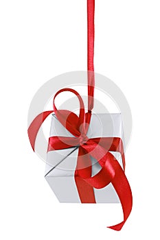 Hanging on a ribbon silver gift wrapped present