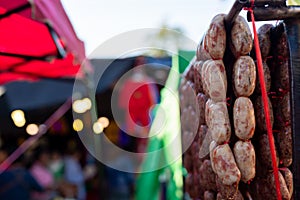 Hanging sausages for sale in market