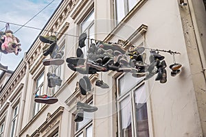 Hanging shoes at a wire in the old town of Flensburg in northern Germany