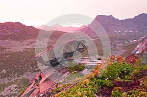 Hanging stone in Ergaki ridge under the sunset photo