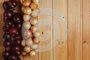 Hanging strings of red and white onions