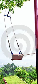 Hanging swing on the mountain that will get your adrenaline pumping photo