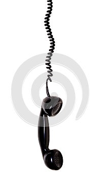 Hanging telephone receiver isolated on white