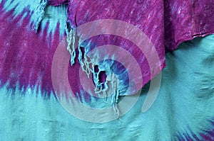 Hanging tie dye background with tassels