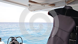 Hanging wetsuits at scuba diving boat