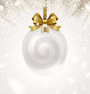 Hanging white Christmas bauble with glitter golden ribbon on a winter snow background. Christmas ball with copy space for your gre