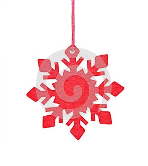Hanging wooden snowflake Christmas tree ornament isolated on white background