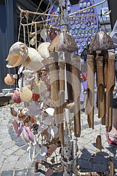 Hanging wooden wind bell. Close-up. Blurred background