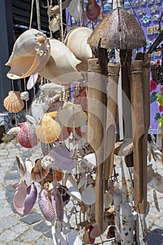 Hanging wooden wind bell. Close-up. Blurred background
