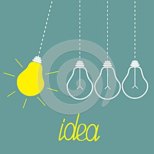 Hanging yellow light bulbs. Perpetual motion. Idea