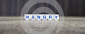 Hangry boggle word cubes on dark background