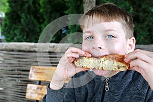 Hangry child eating bread