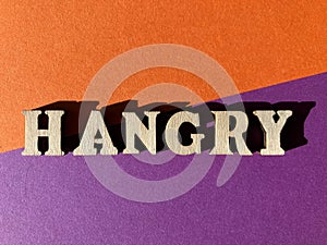 Hangry, a portmanteau or blended word mader from angry and hungry